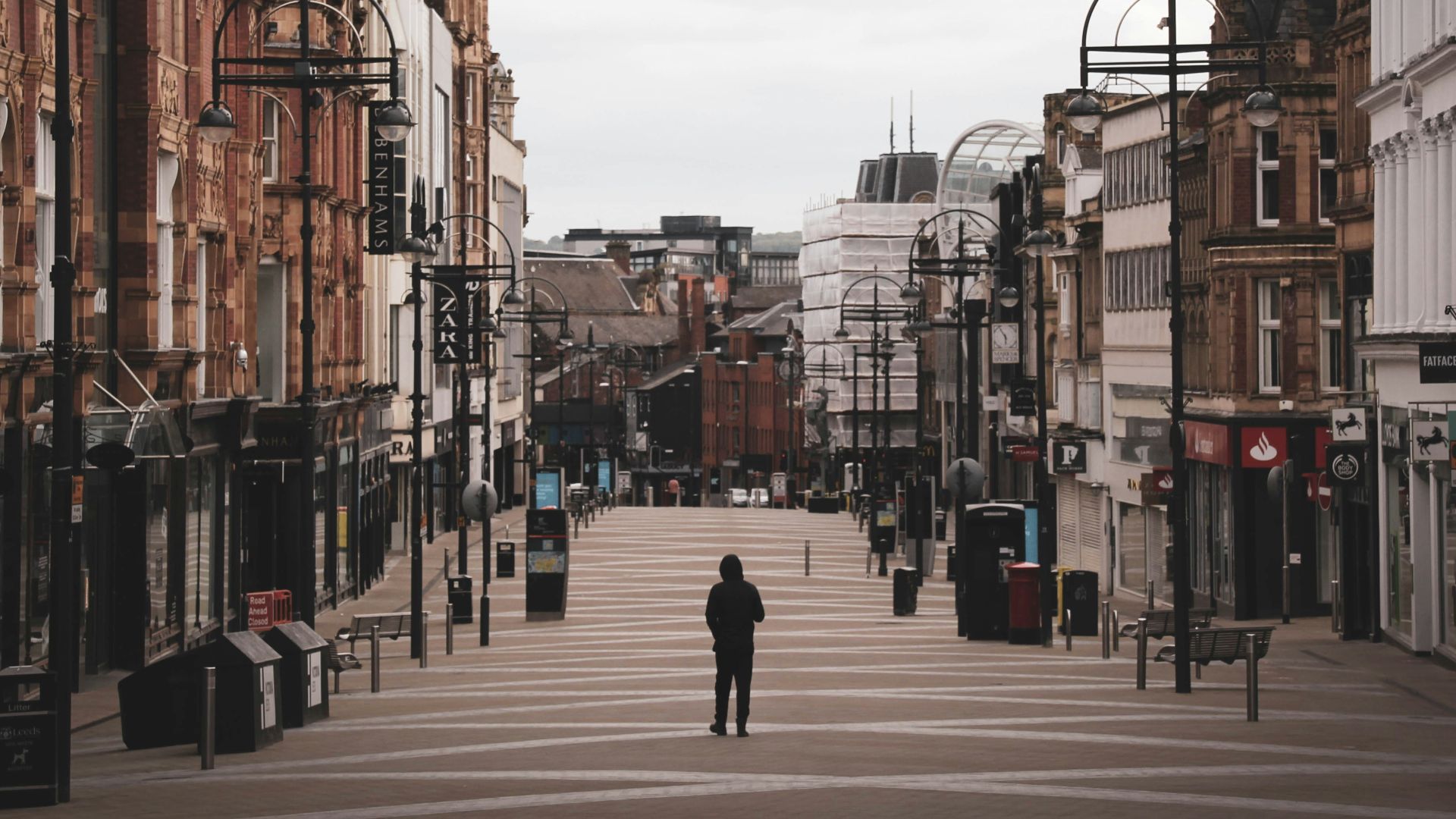 people walking on sidewalk near buildings during daytime