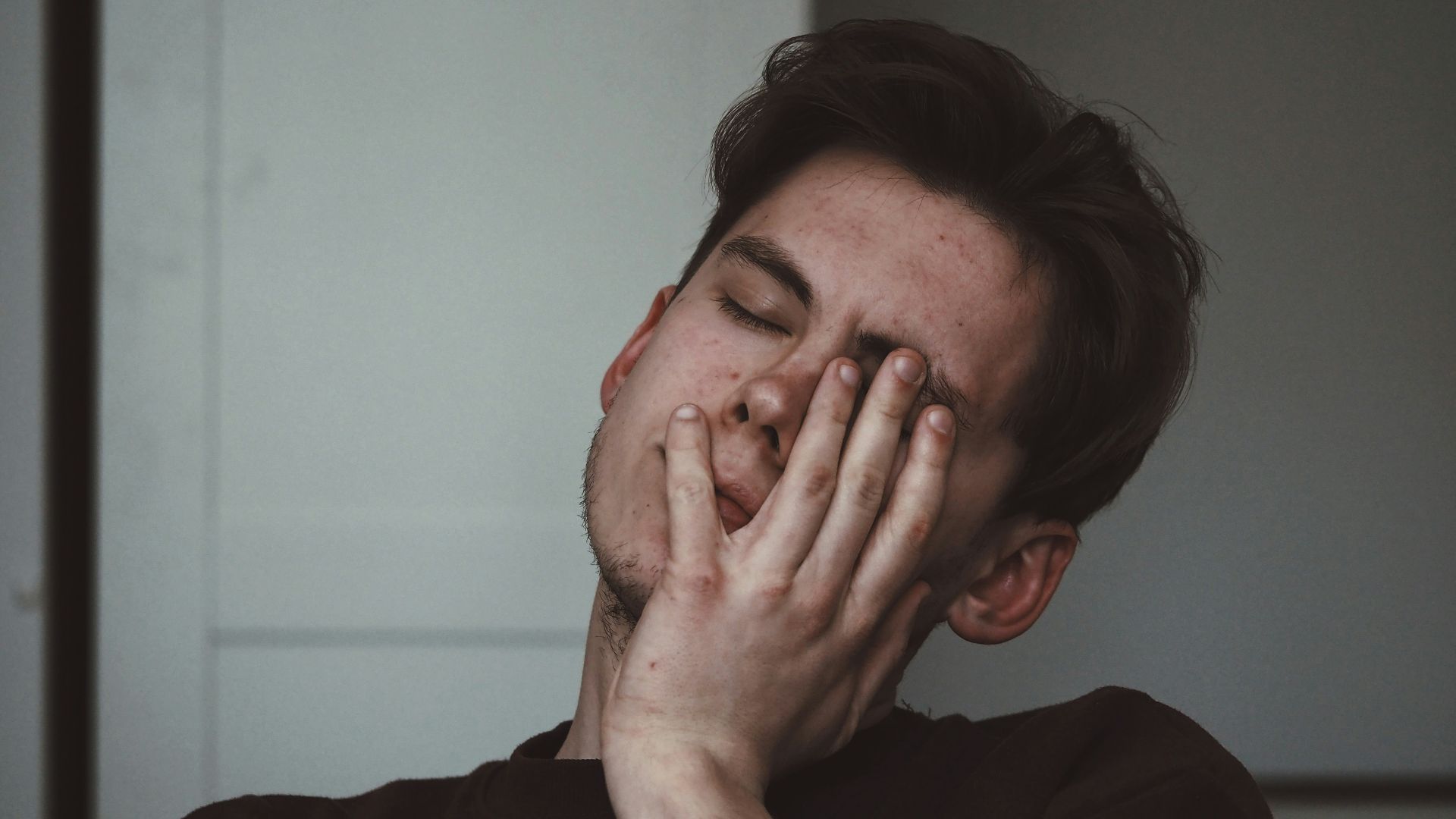 man wearing black crew-neck top