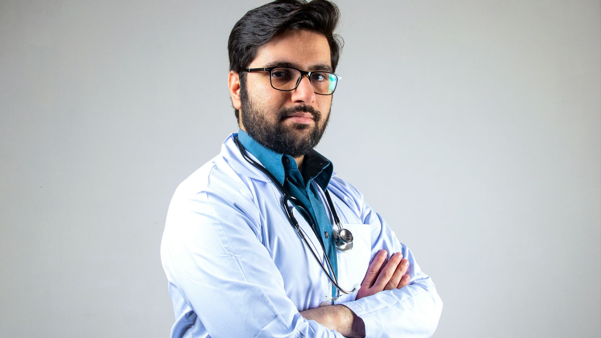 man in white dress shirt wearing black framed eyeglasses