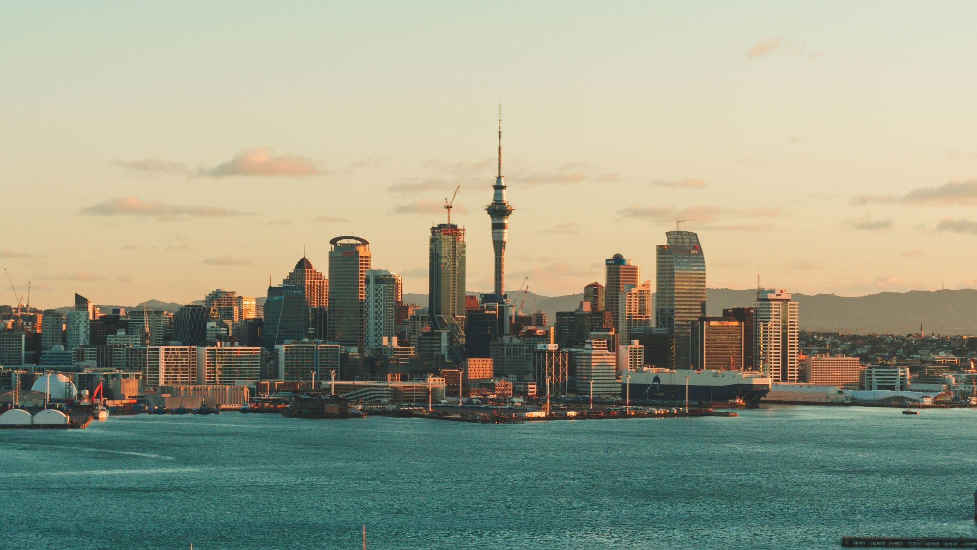 city skyline across body of water during daytime