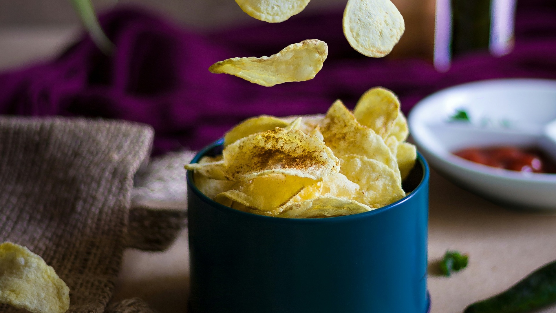 blue ceramic mug on green table cloth