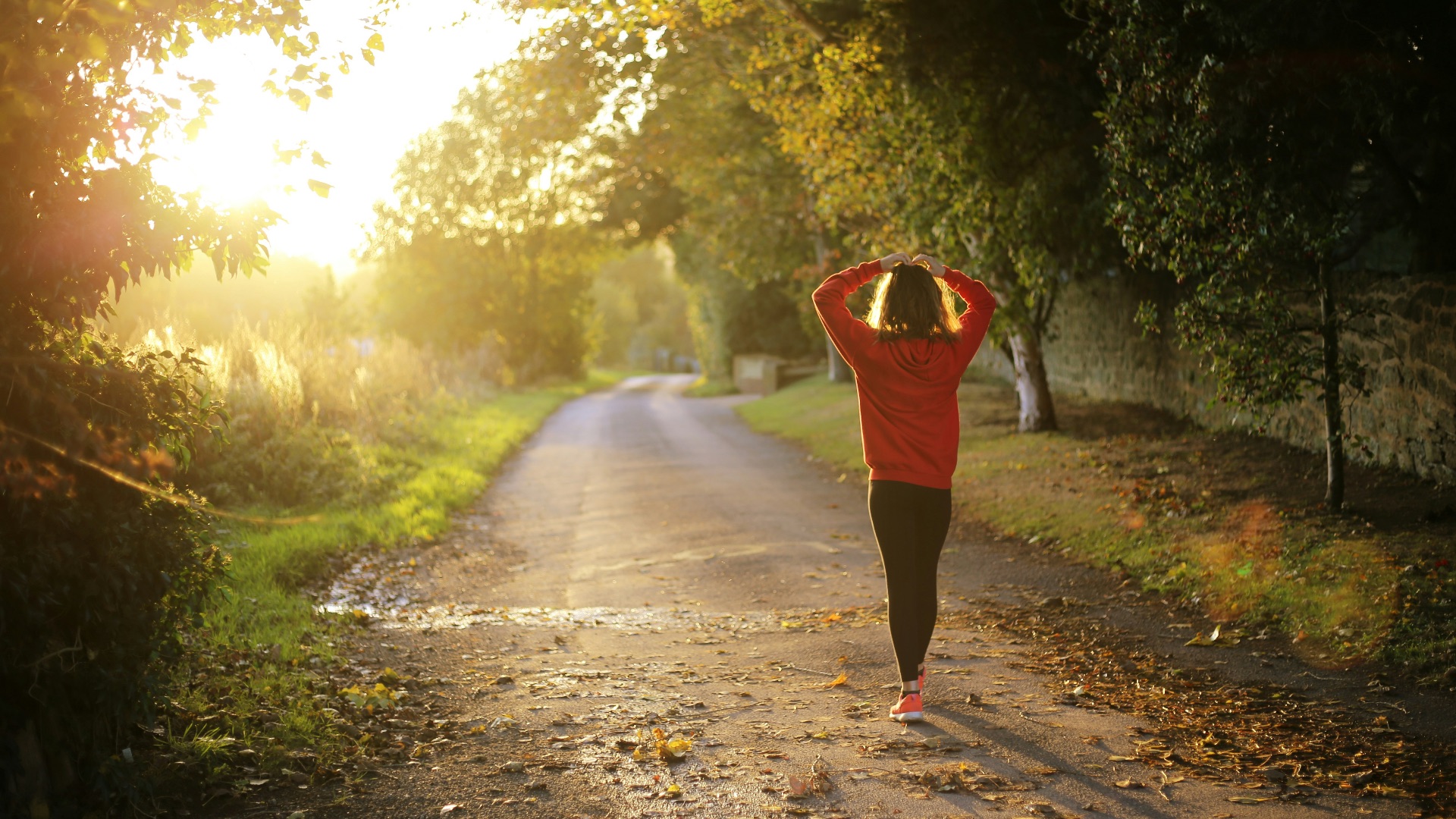 woman walking on pathway during daytime