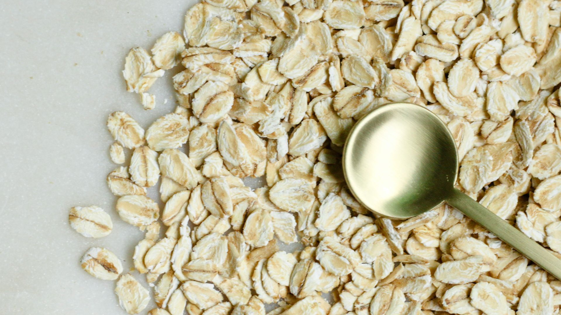 brown rice on white textile