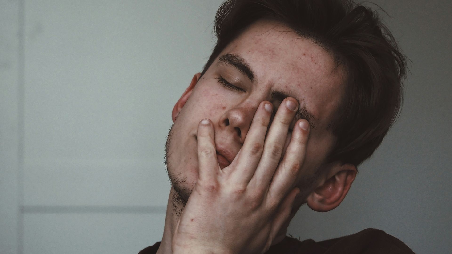 man wearing black crew-neck top