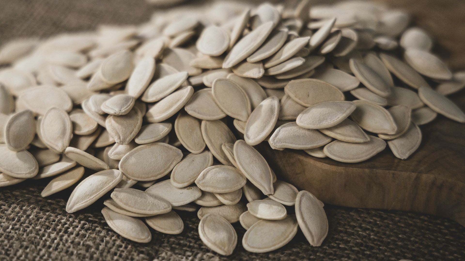 brown seeds on brown wooden surface