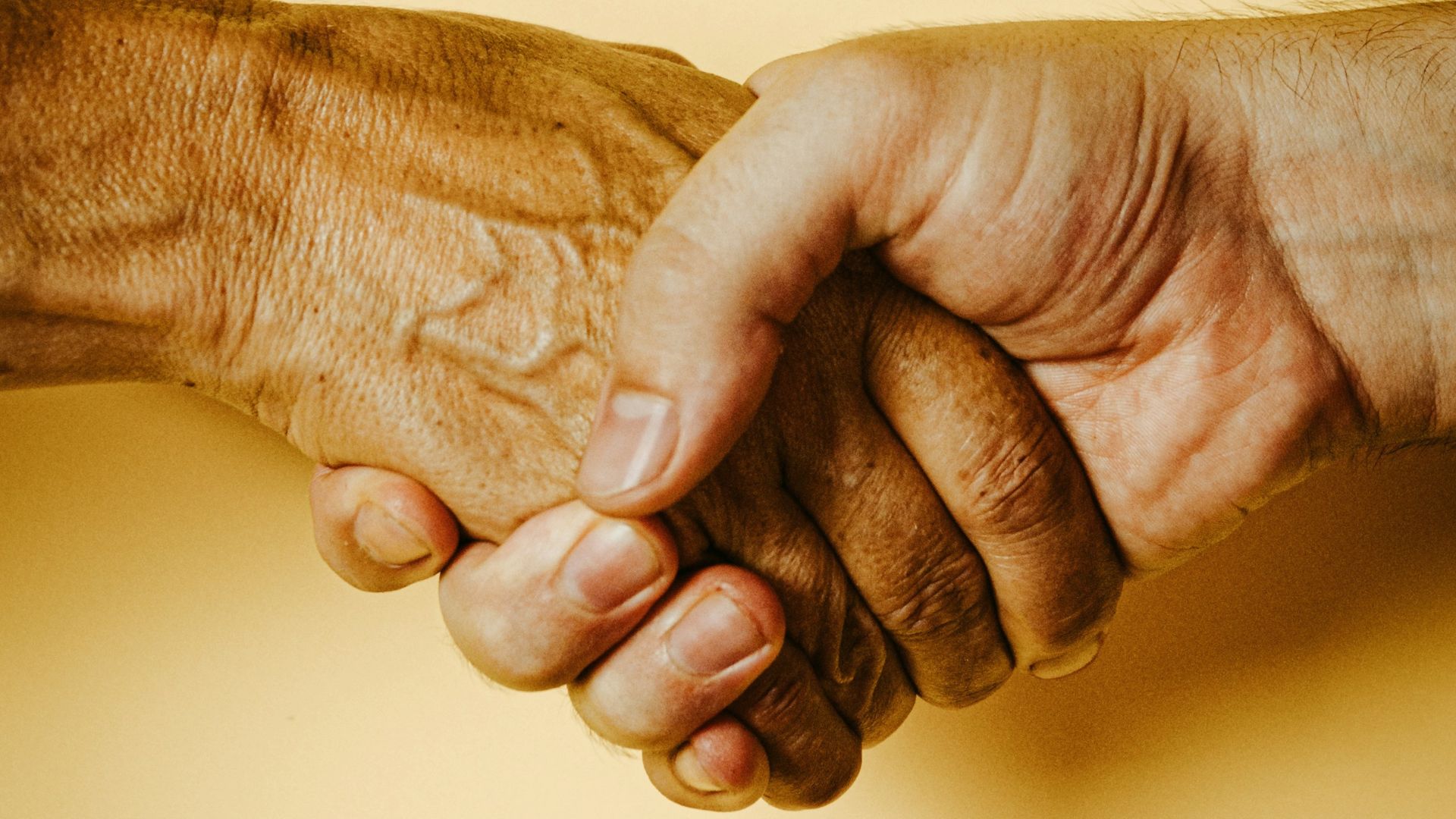 person holding babys hand
