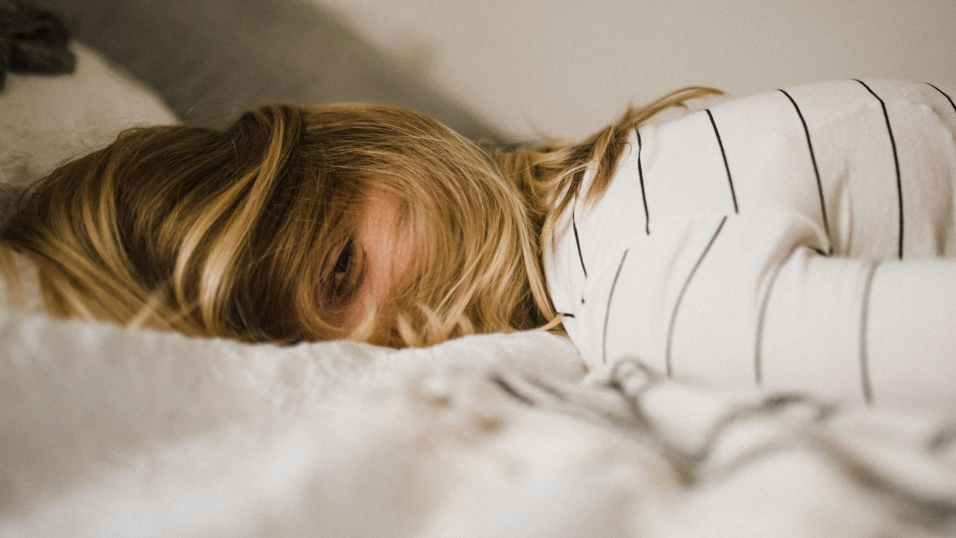 woman lying on bed
