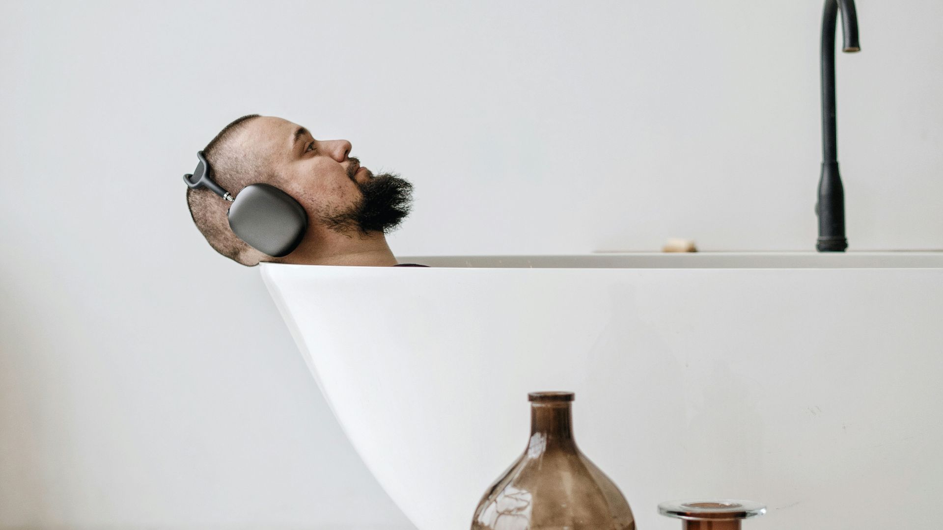 brown glass bottle on white table