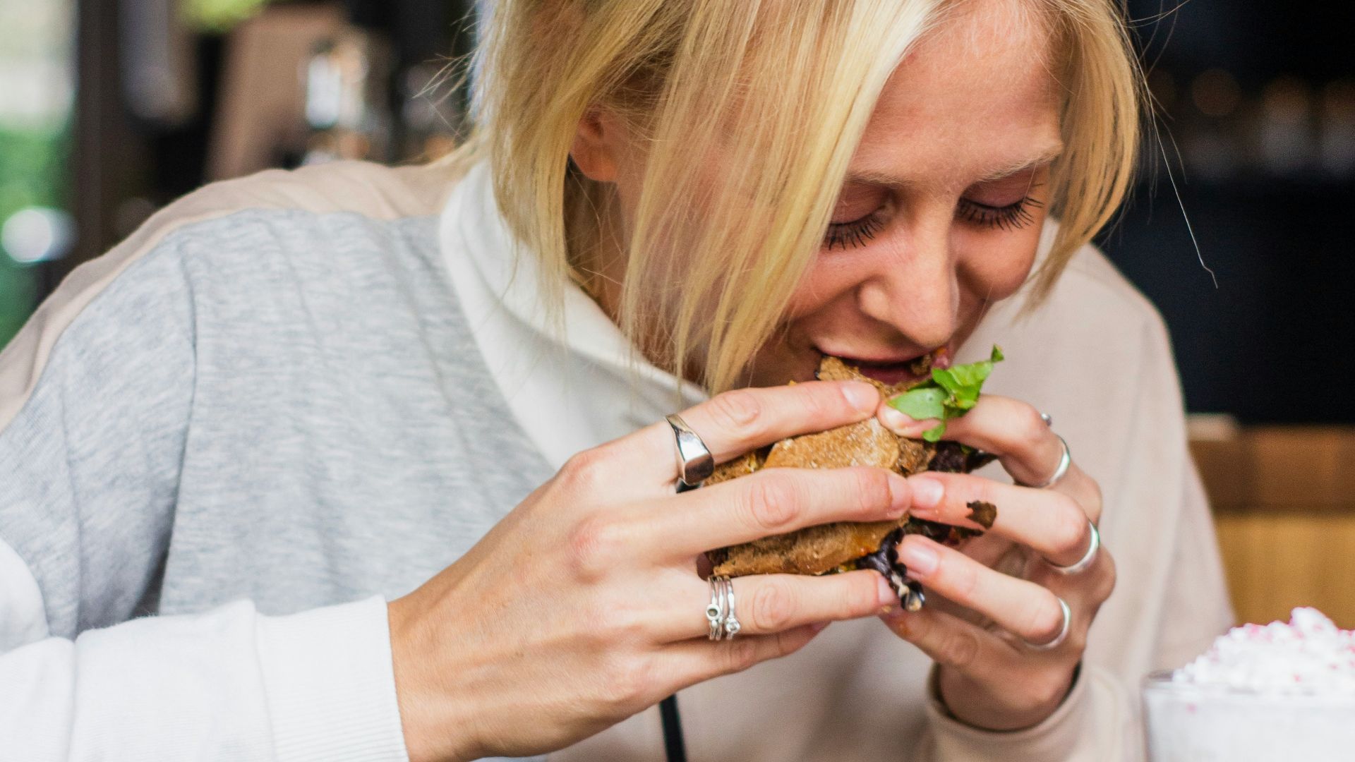woman eating burger