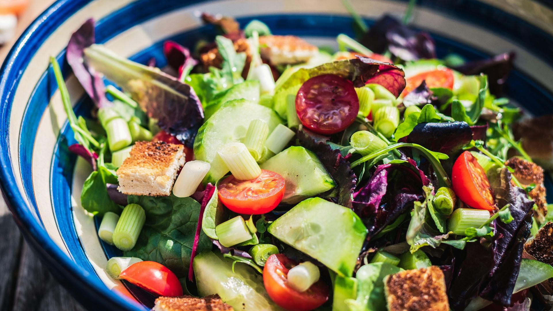 leafy vegetable dish in blue ceramic bowl
