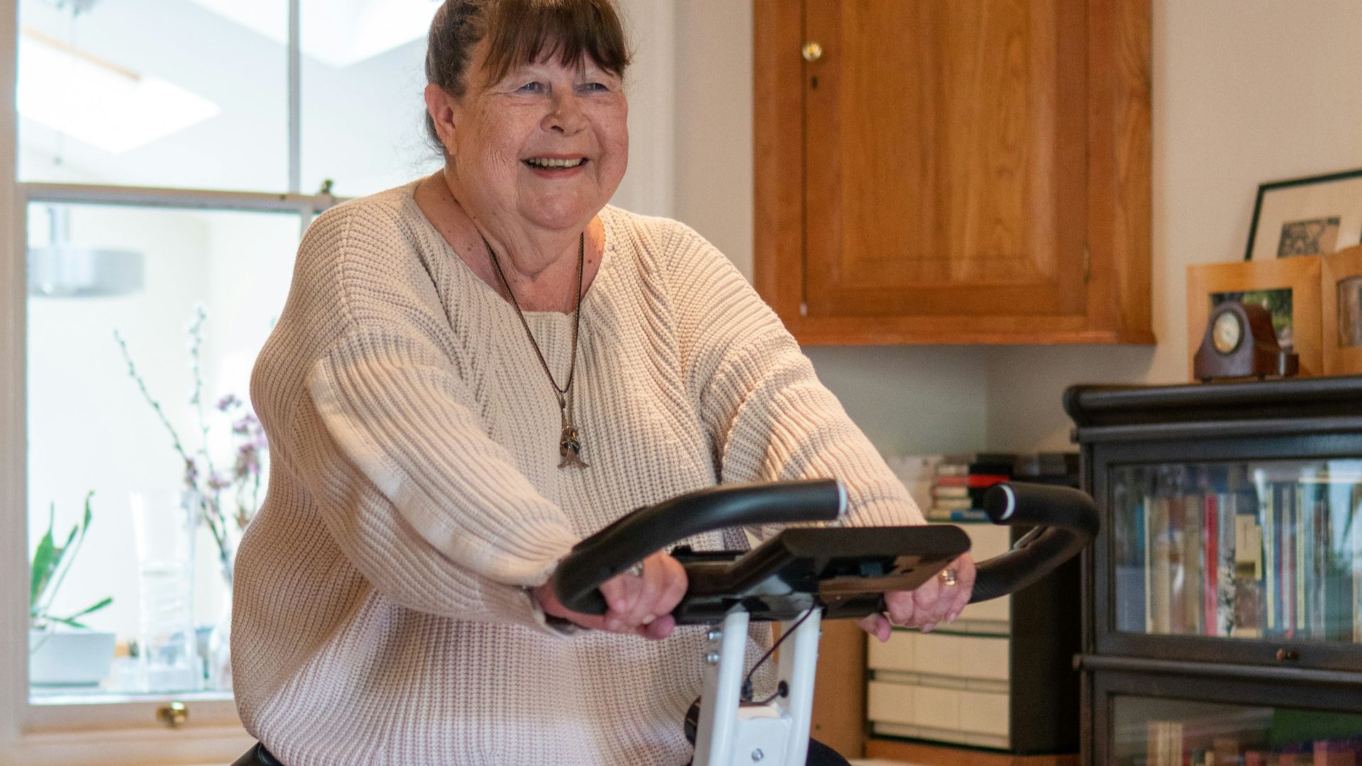 a woman standing on a scooter