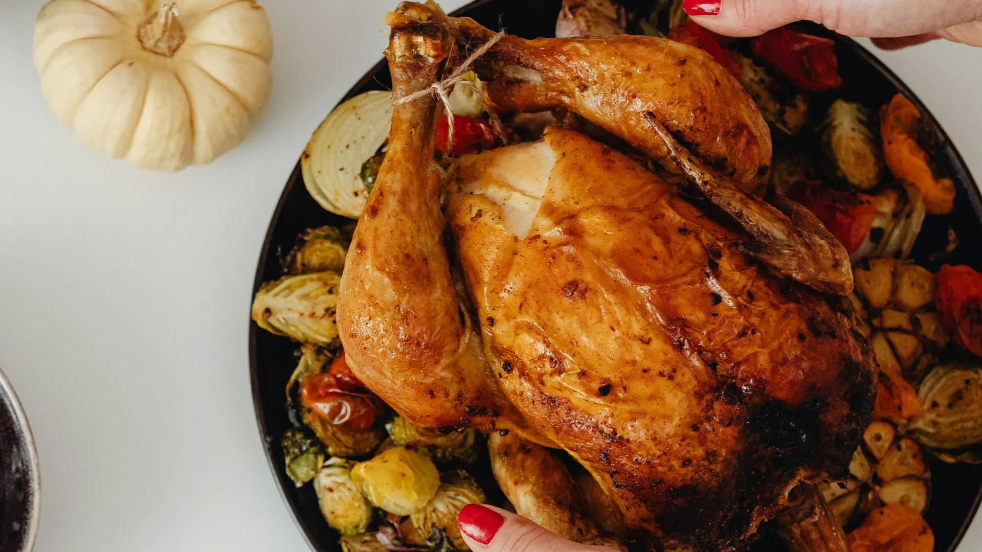 a person holding a plate of food