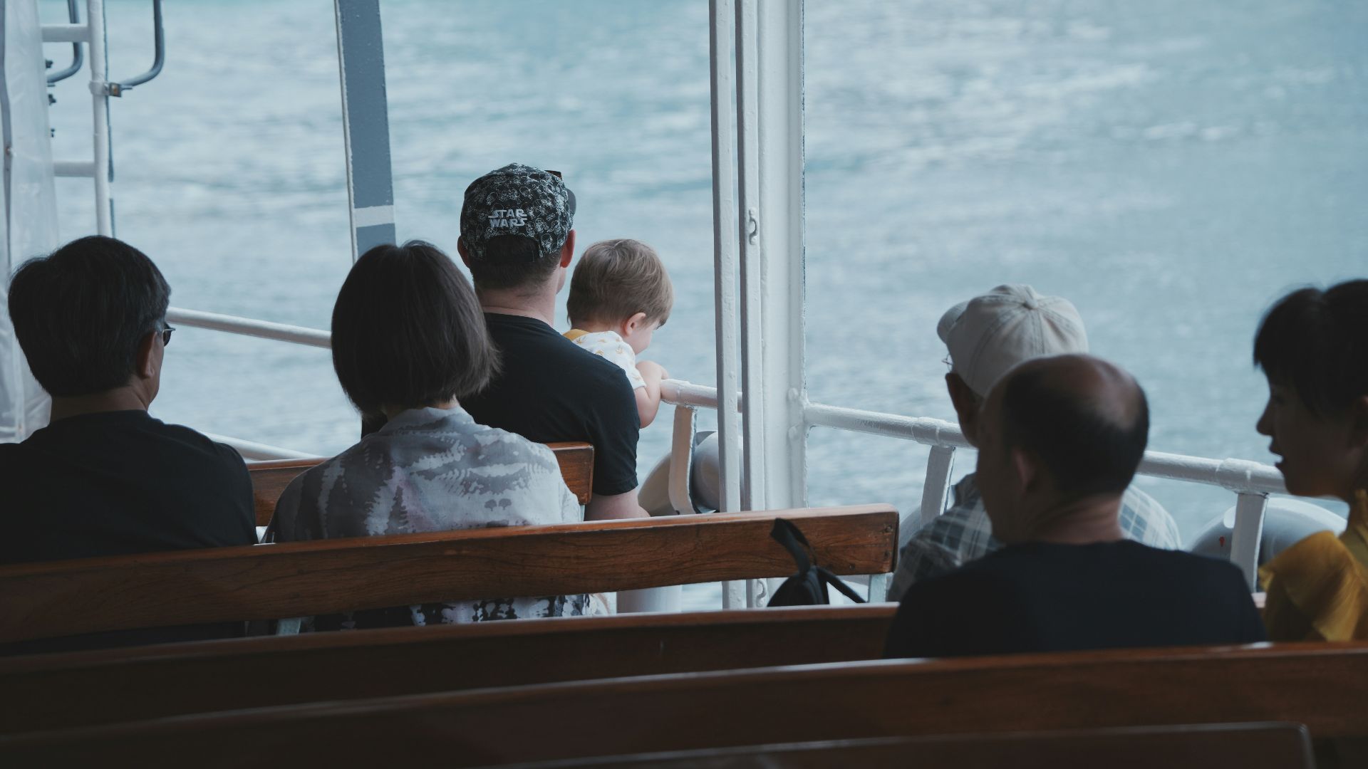 a group of people sitting on top of a boat
