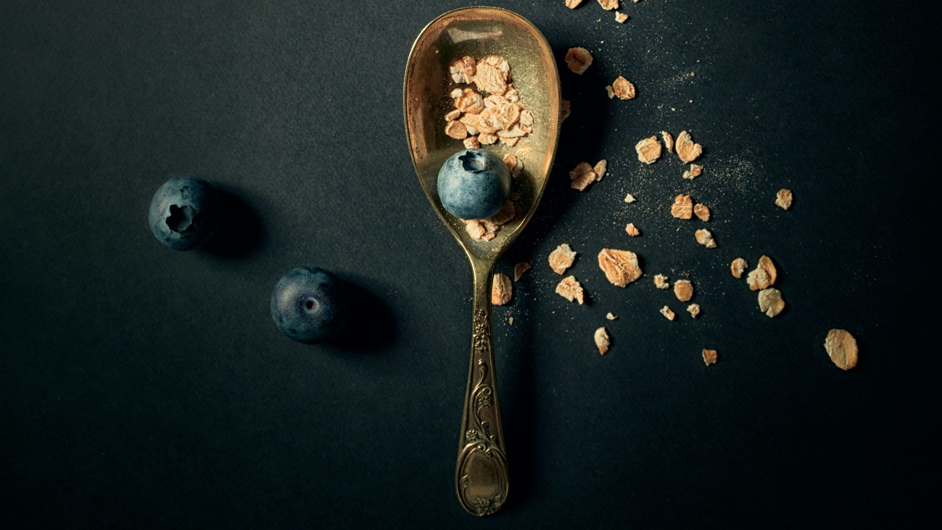 silver spoon and fork on blue surface