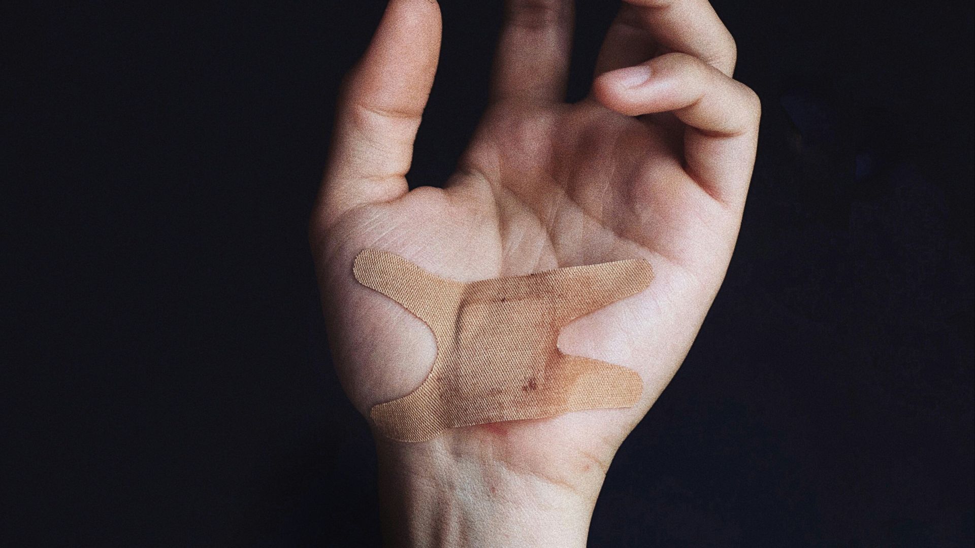 person's left palm with bandage