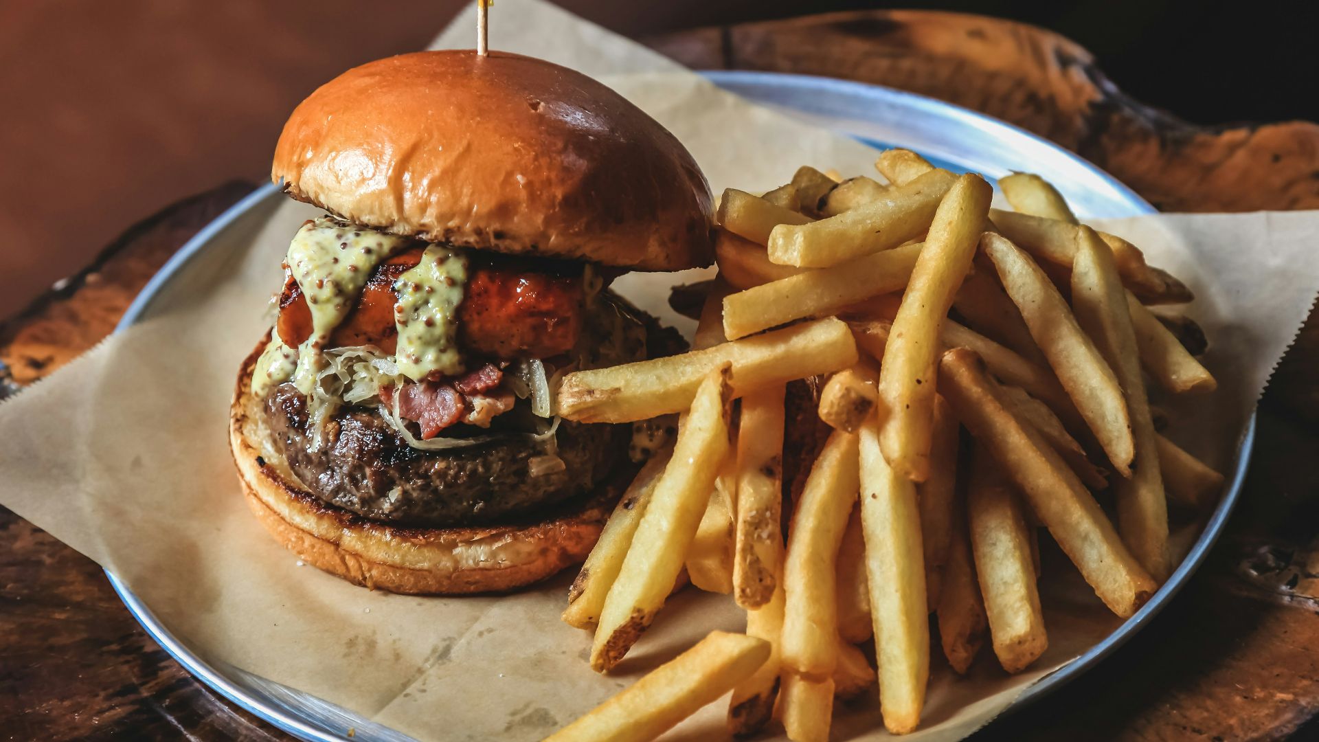 burger with fries on white ceramic plate