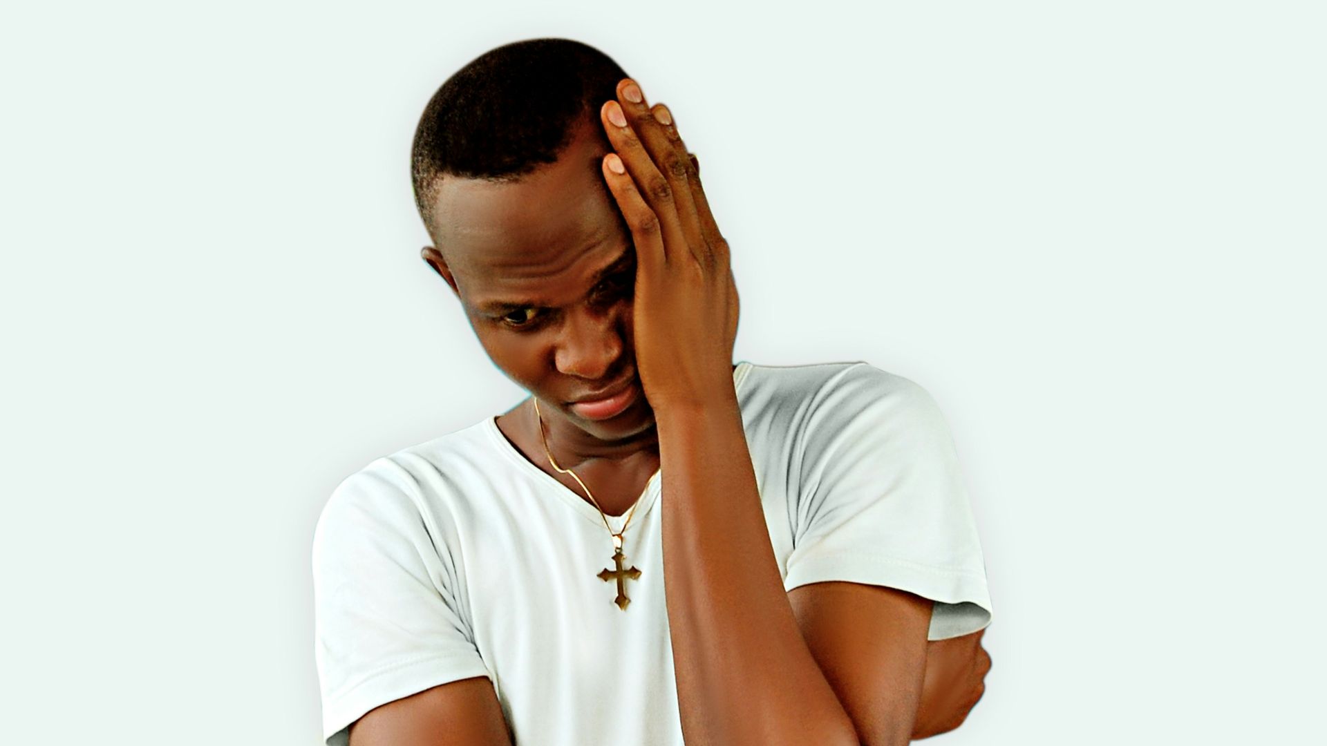 man in white crew neck t-shirt covering his face