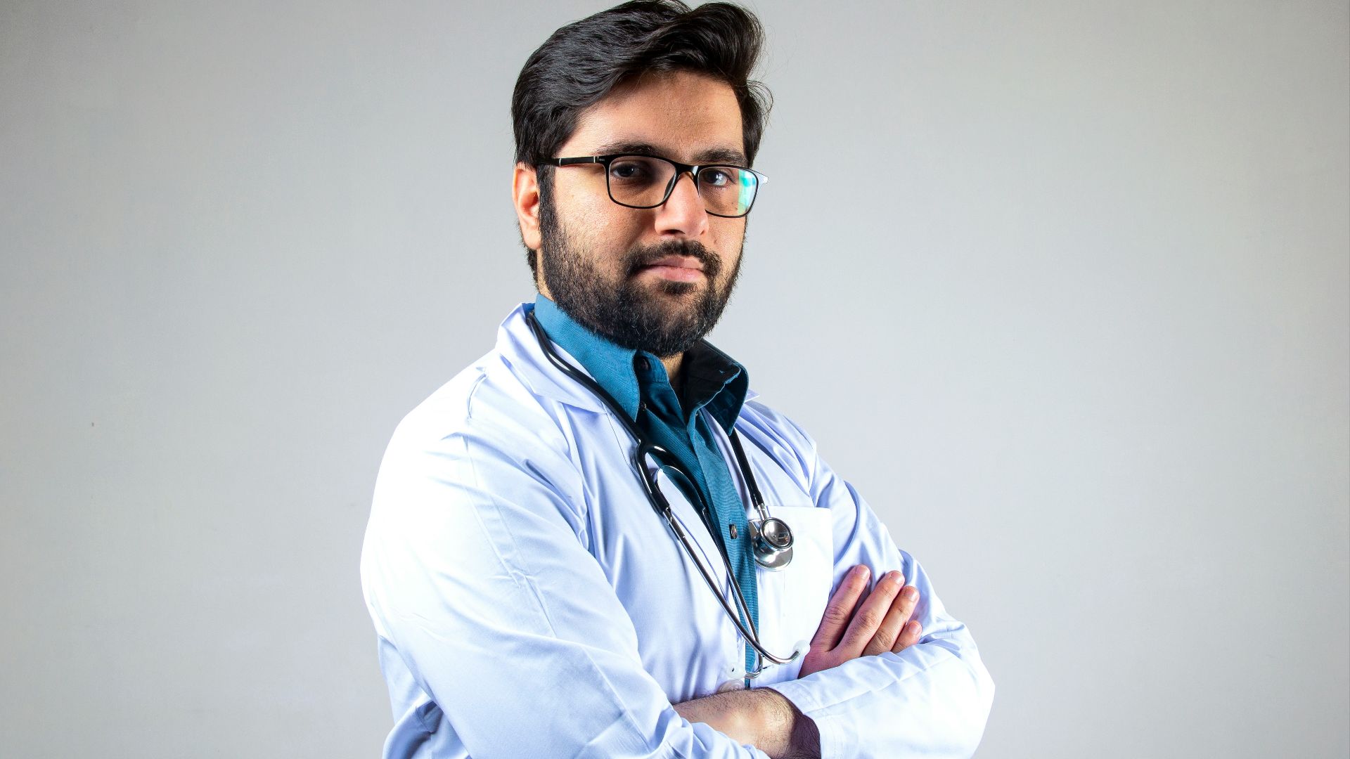man in white dress shirt wearing black framed eyeglasses