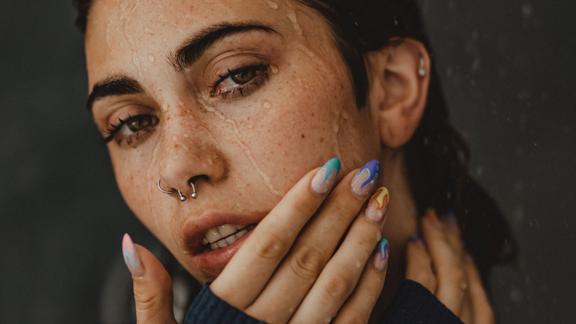 a woman with her hands on her face