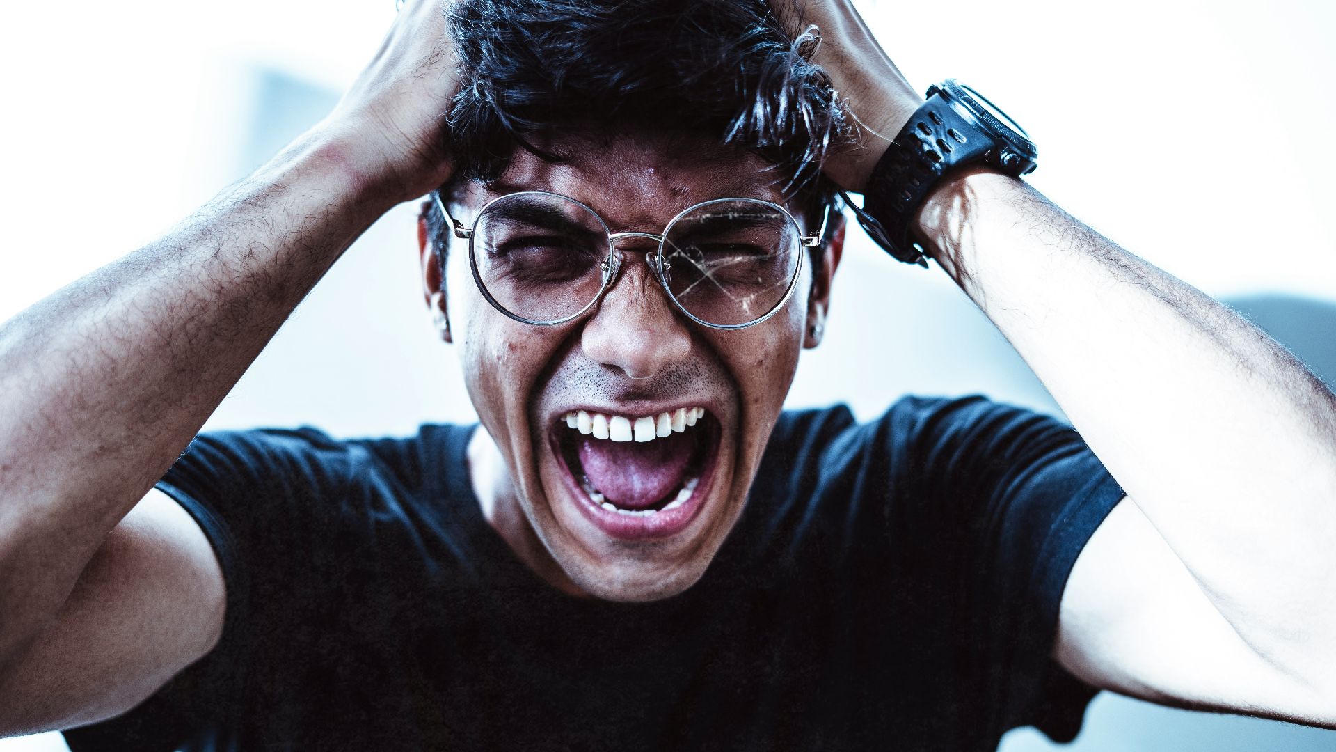 man in black crew neck t-shirt smiling