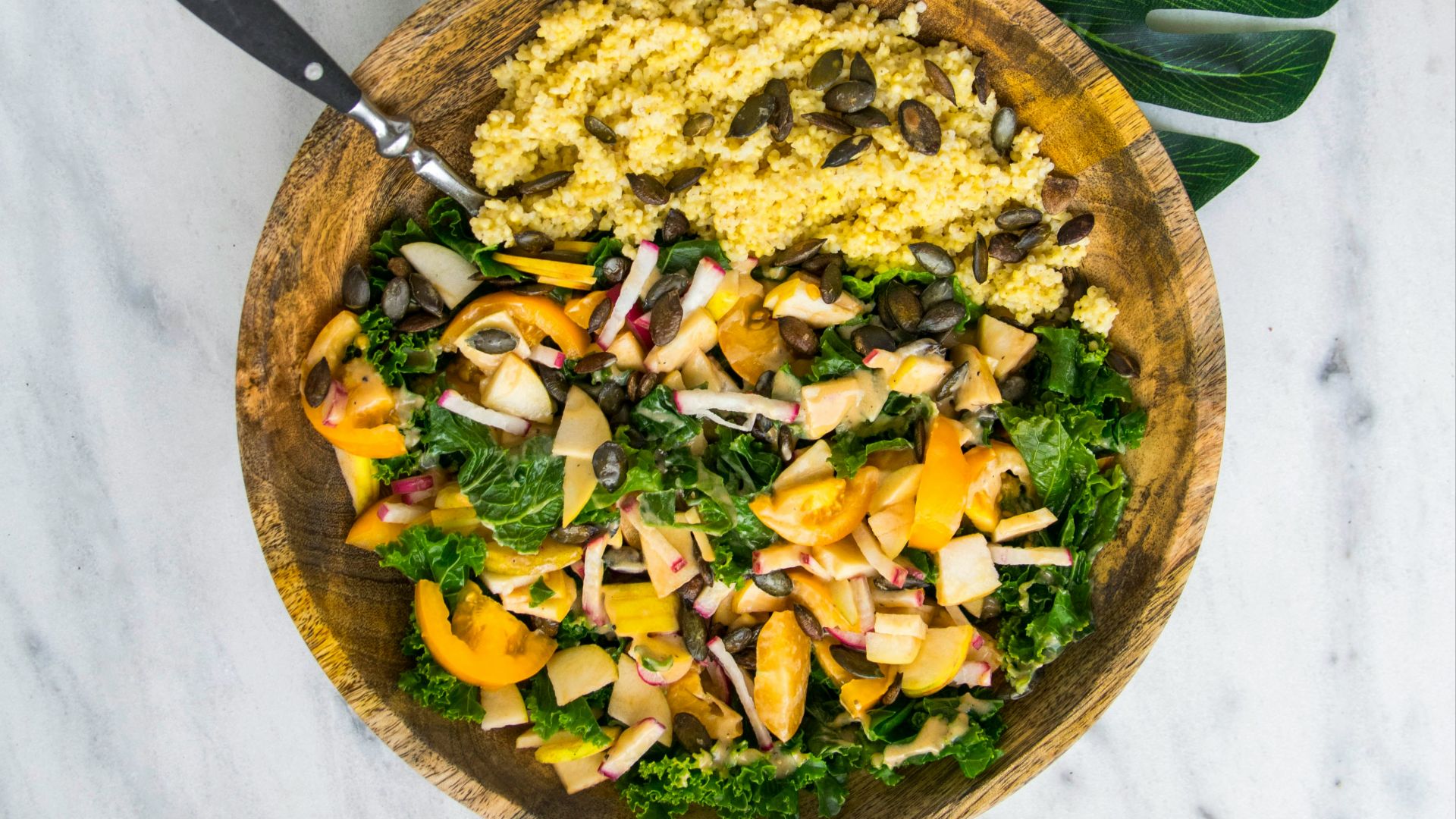 cooked rice with vegetable salad in brown wooden bowl