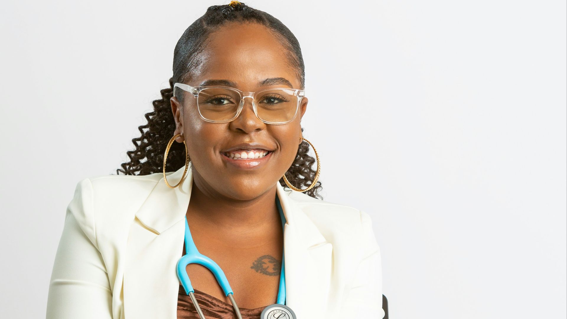 a woman in a white coat