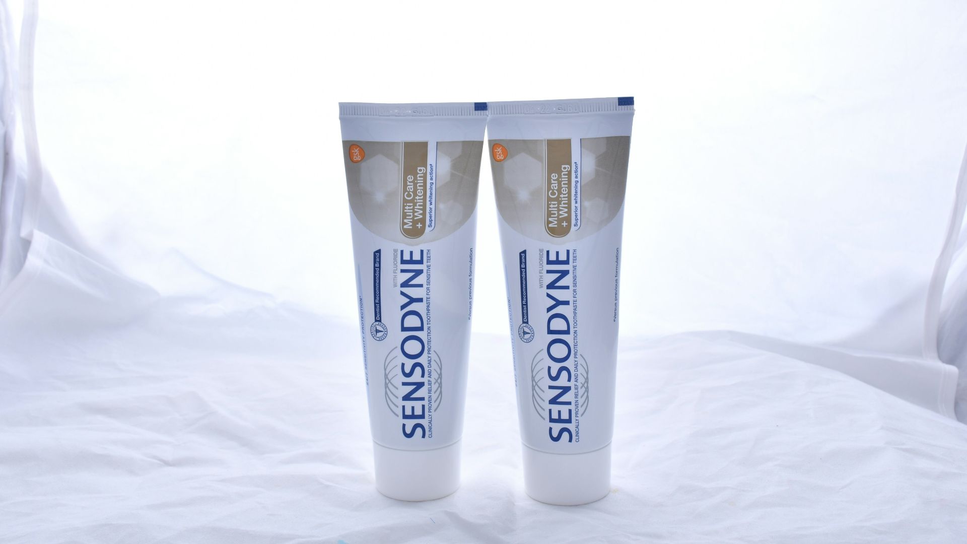 white and black plastic tube bottle