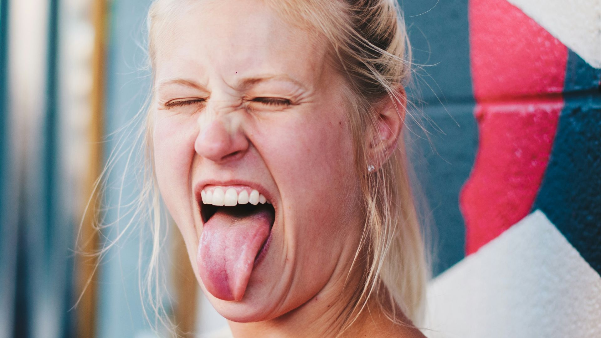 woman showing tongue