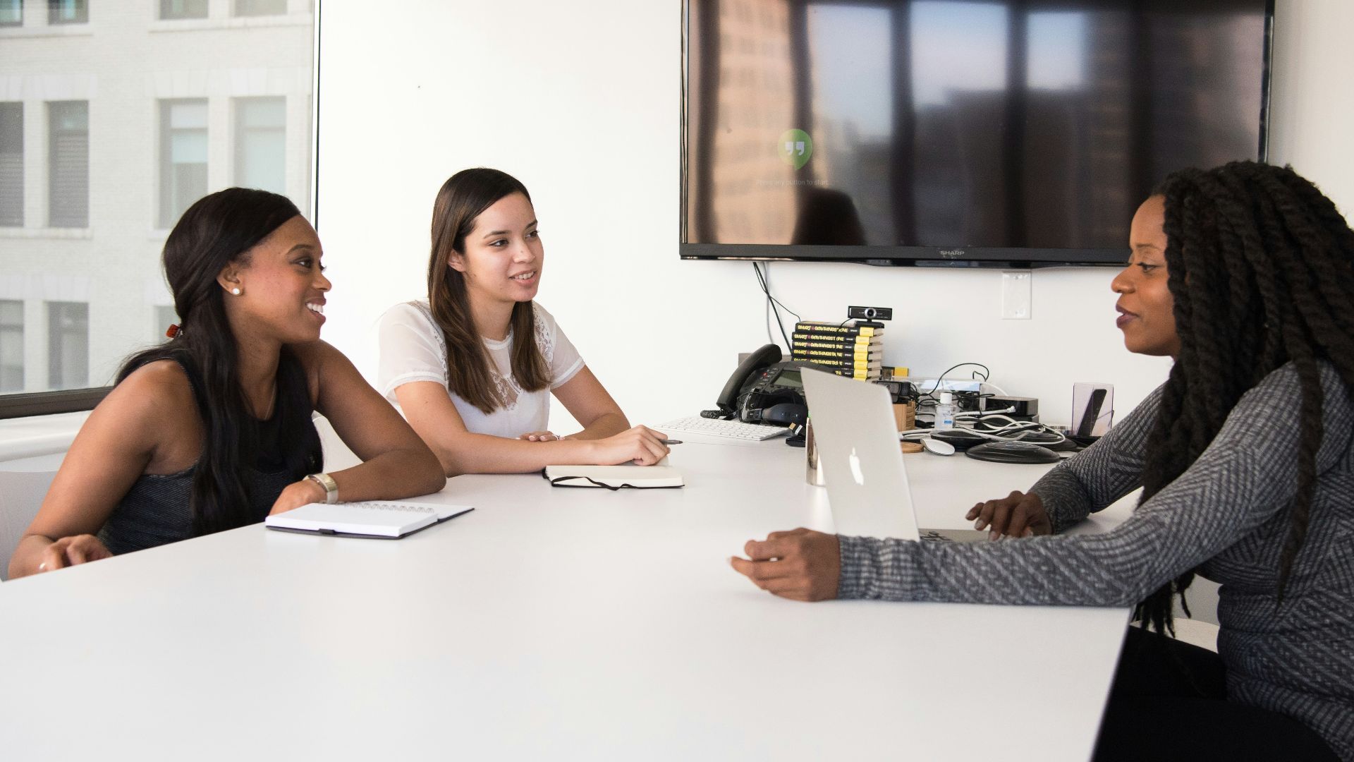 three women sitting at the table