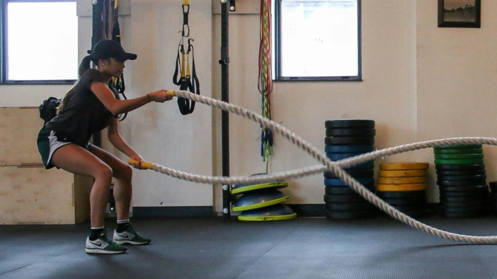 woman holding exercise using training rope