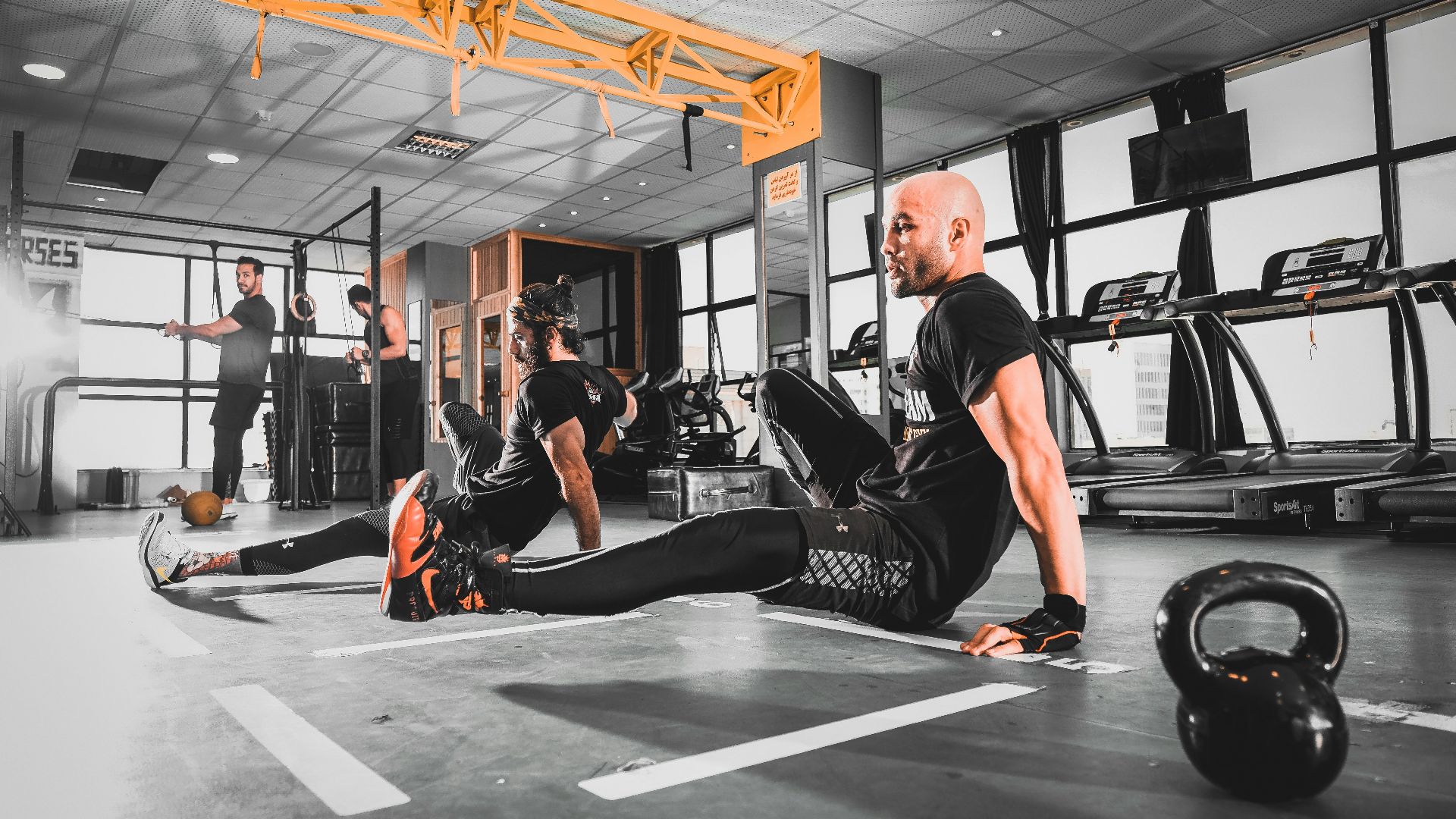 woman in black tank top and black leggings doing exercise