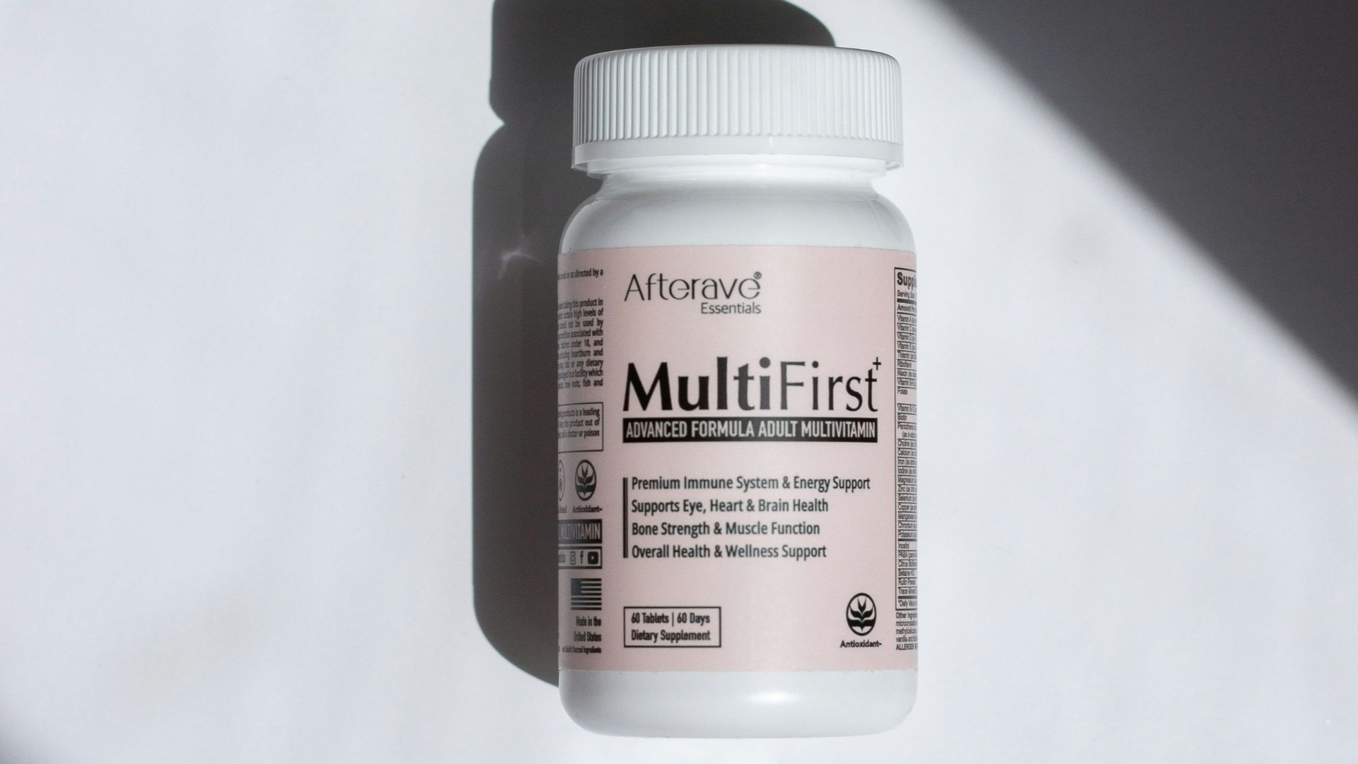 a close up of a bottle of pills on a table