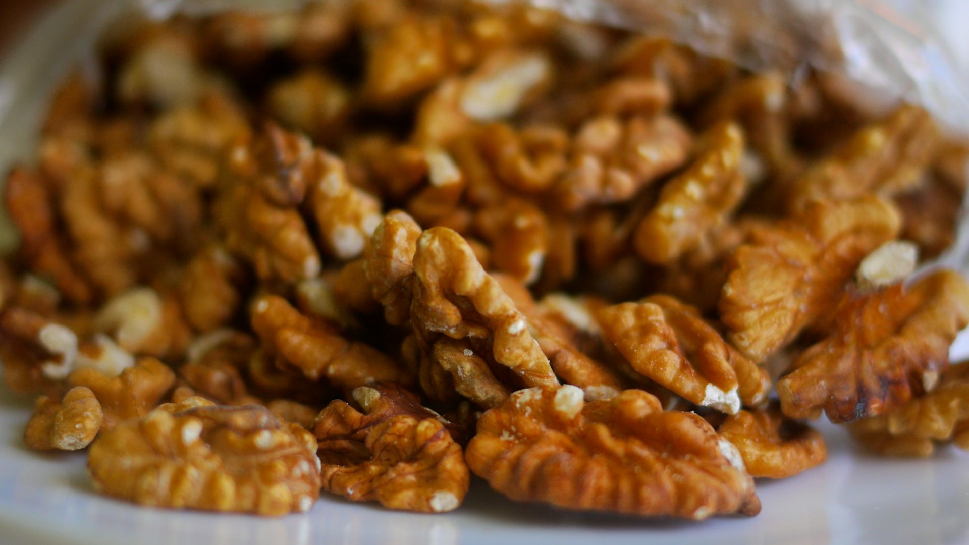 brown peanuts on clear plastic container
