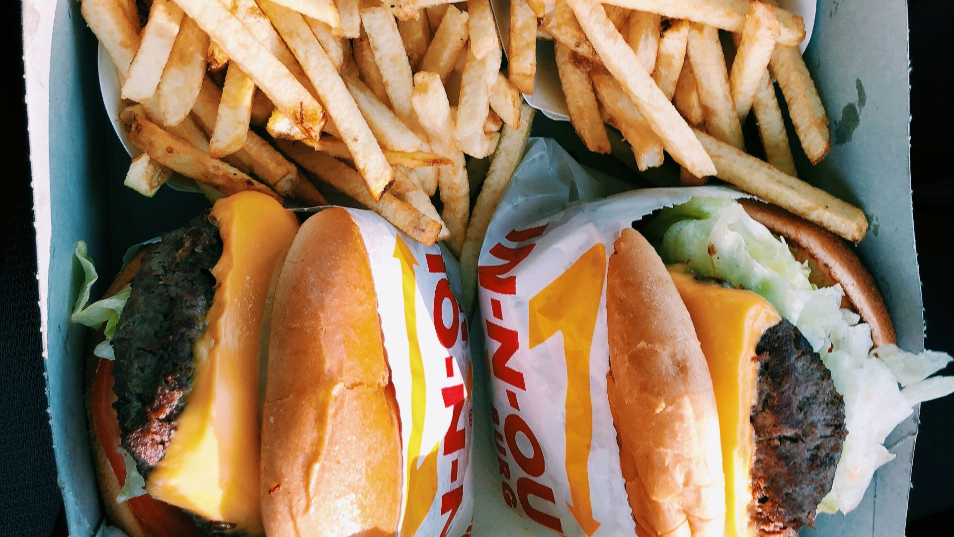 burgers and fries inside box
