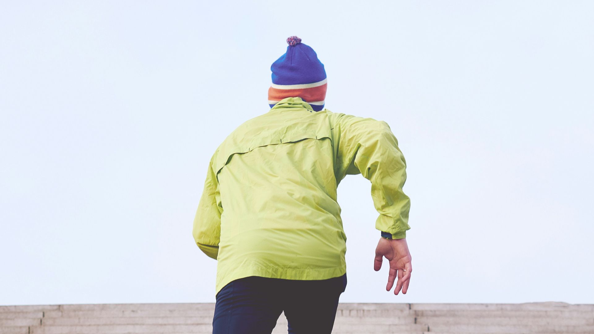 person climbing concrete stairs