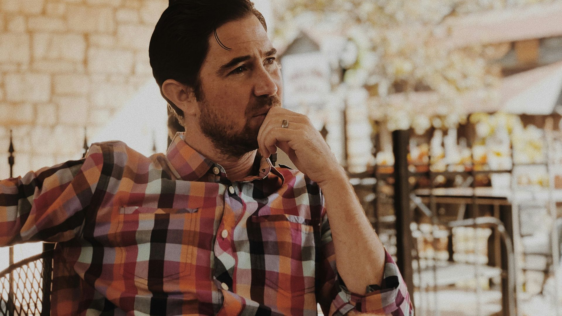 man in red and black plaid dress shirt