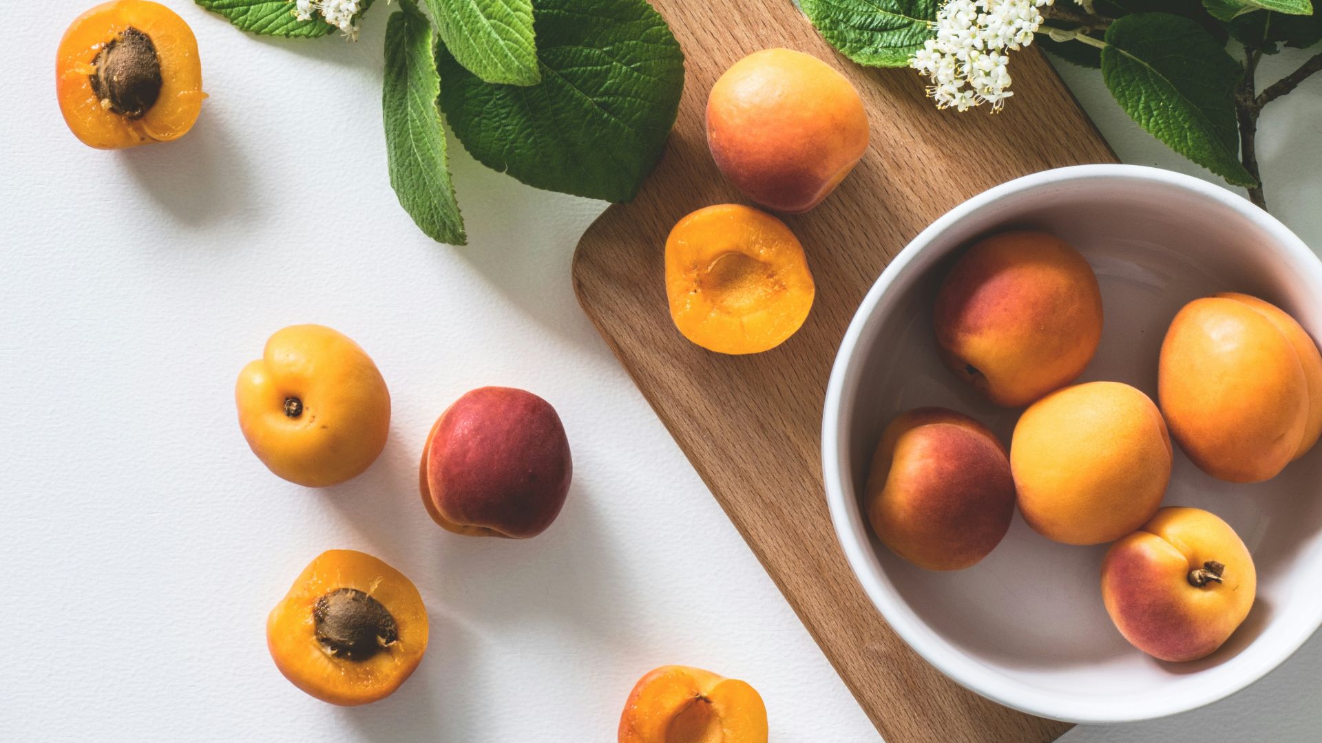 bunch of brown fruits near flowers