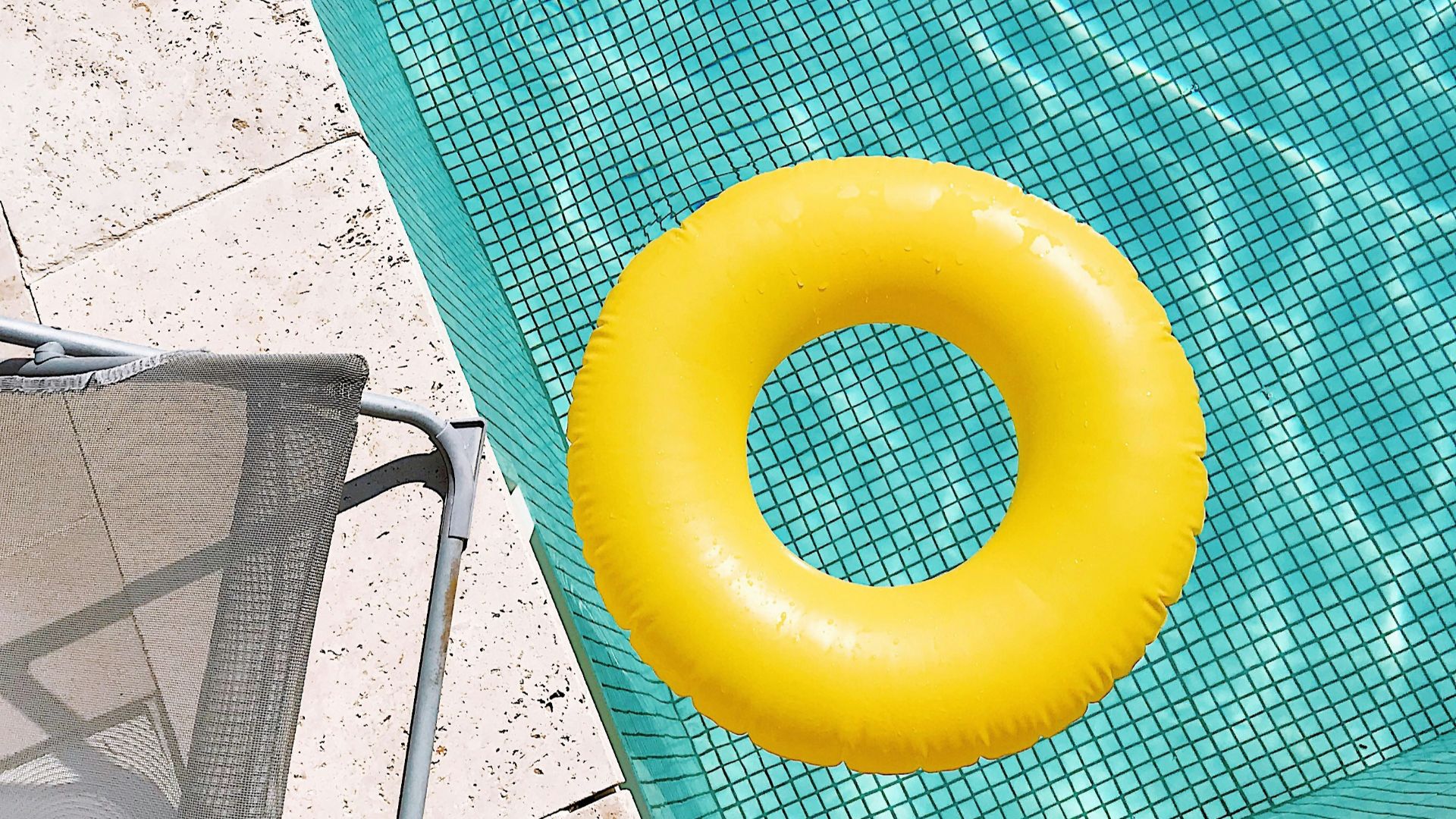 yellow plastic round toy on green table