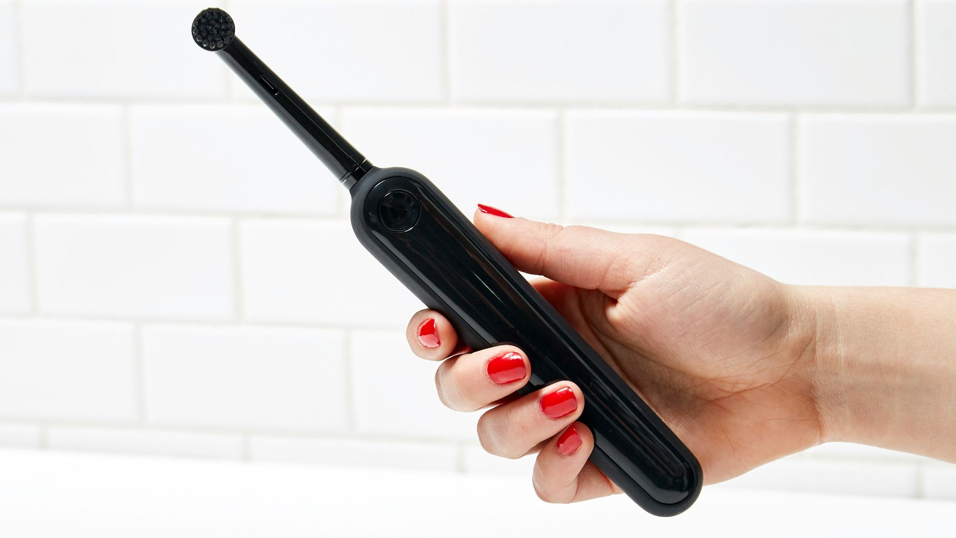 person holding black electronic device