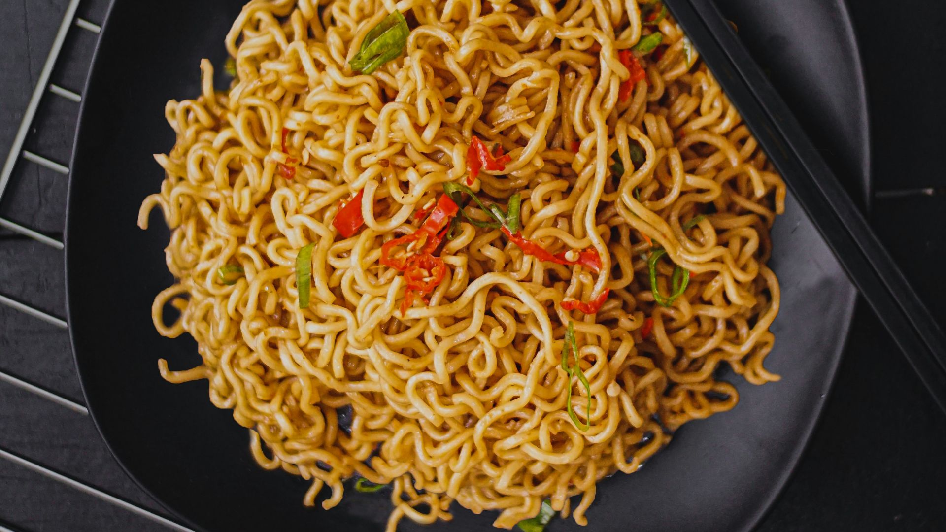 pasta dish on black plate