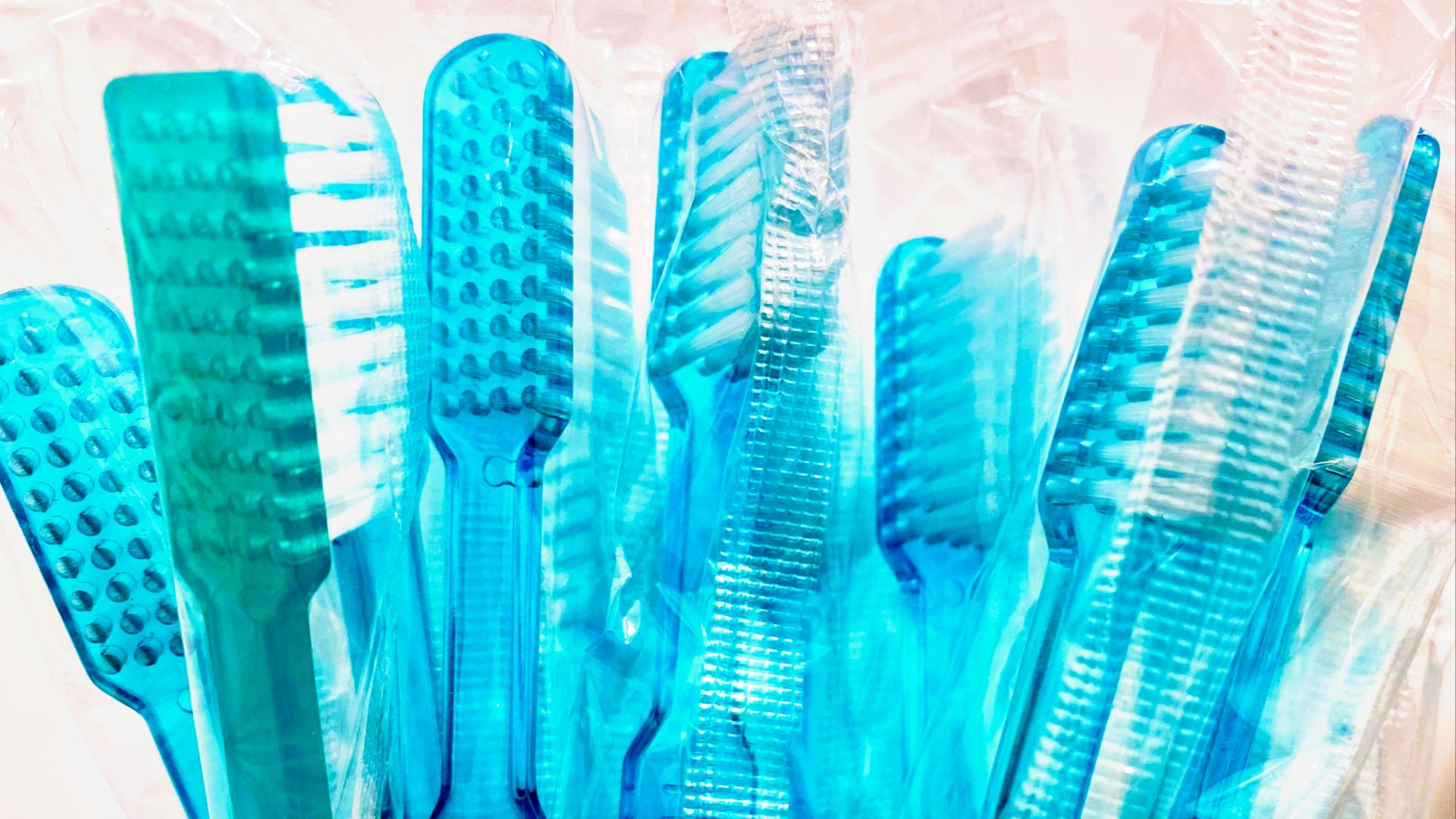 blue and white plastic hair comb