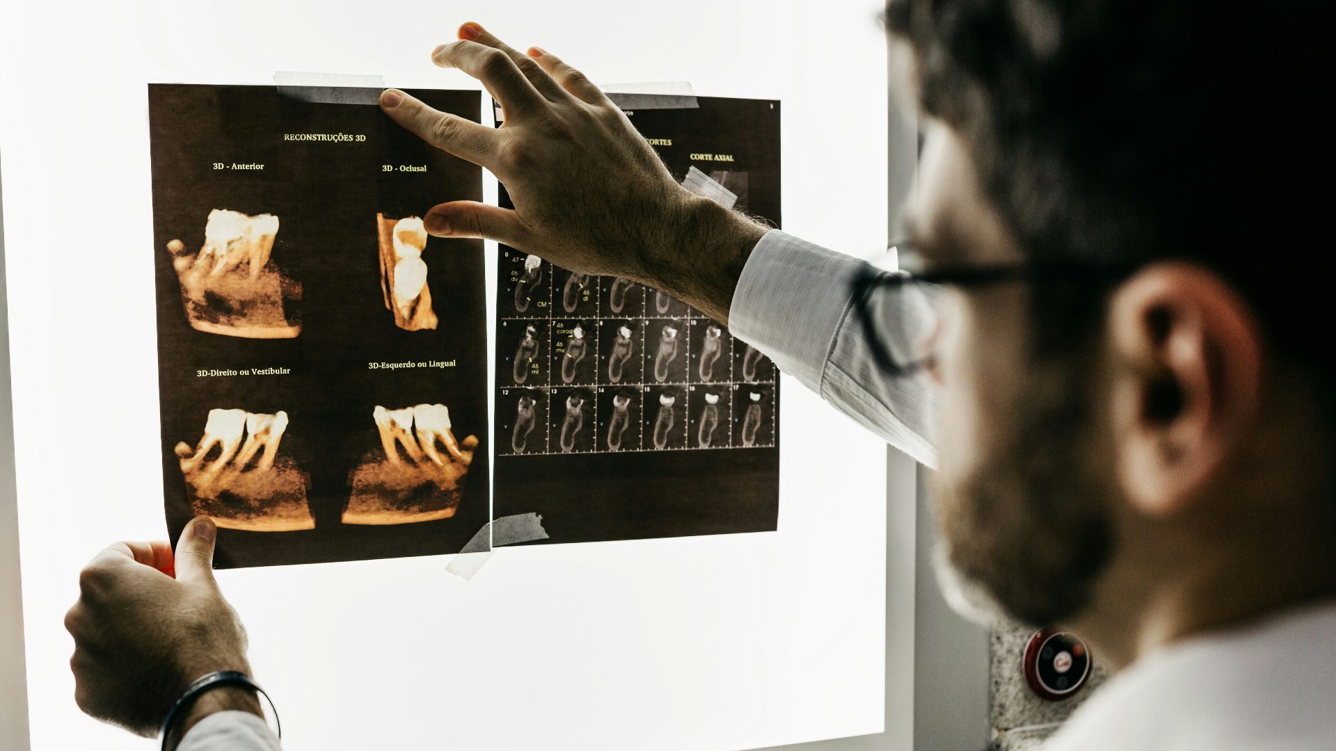 person in gray long sleeve shirt holding black tablet computer