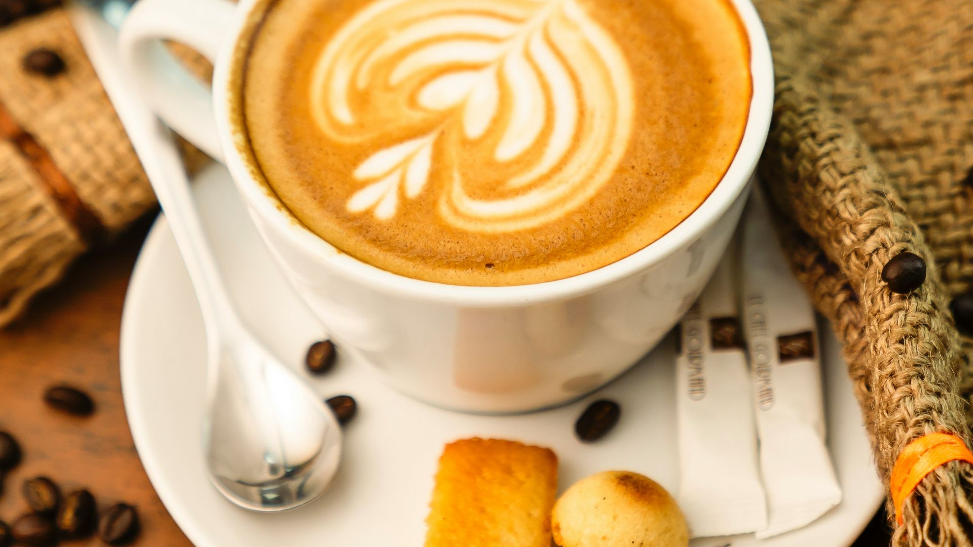 white ceramic cup with brown liquid on white ceramic saucer