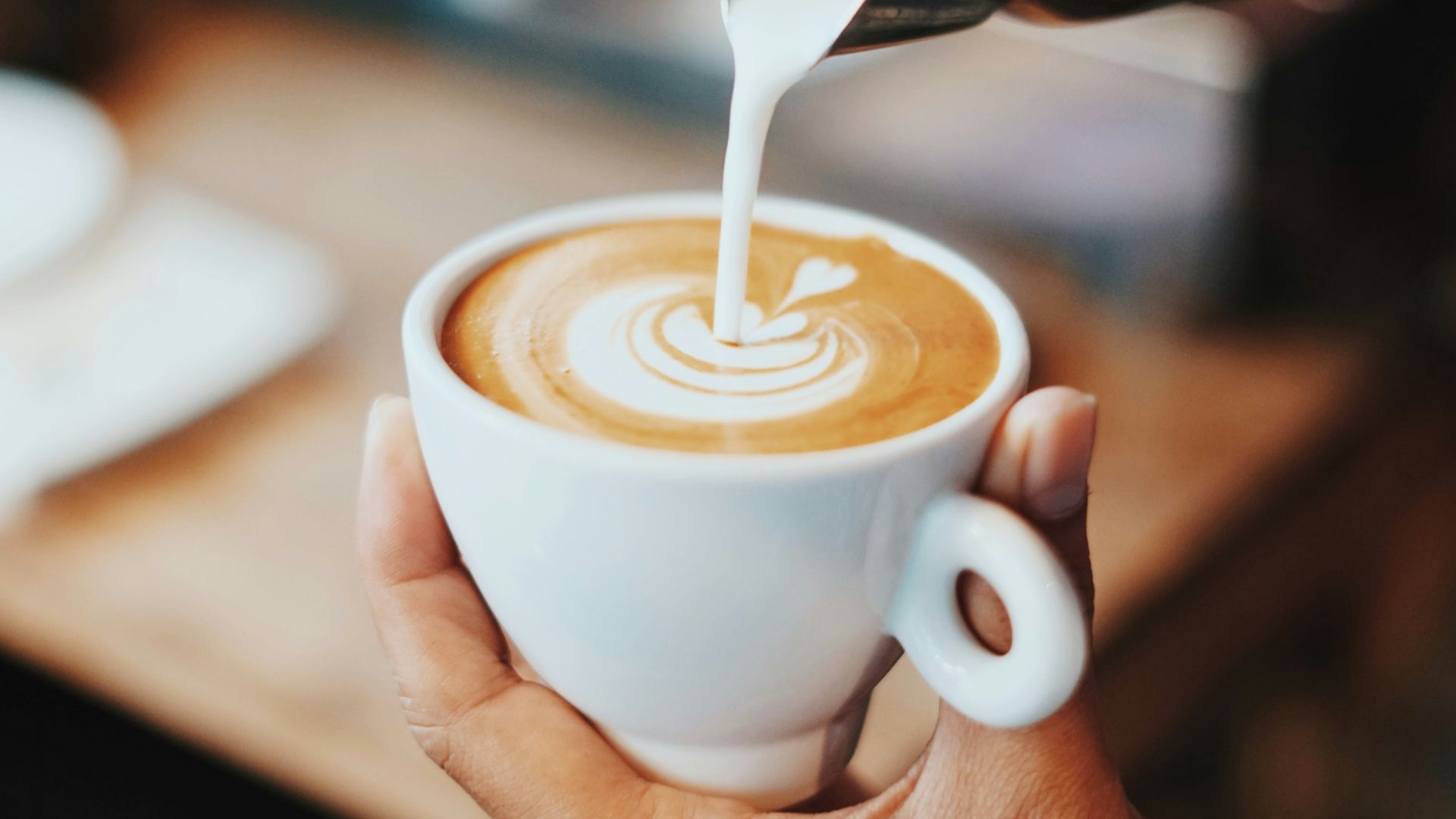 person making latte art