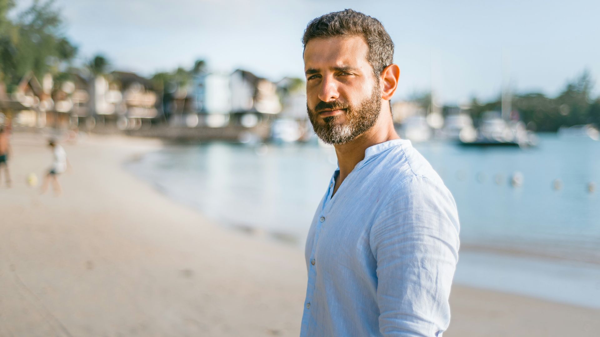 man standing on beach during daytime