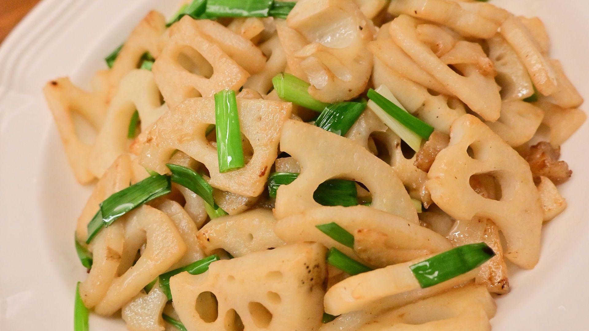 a white plate topped with pasta covered in sauce