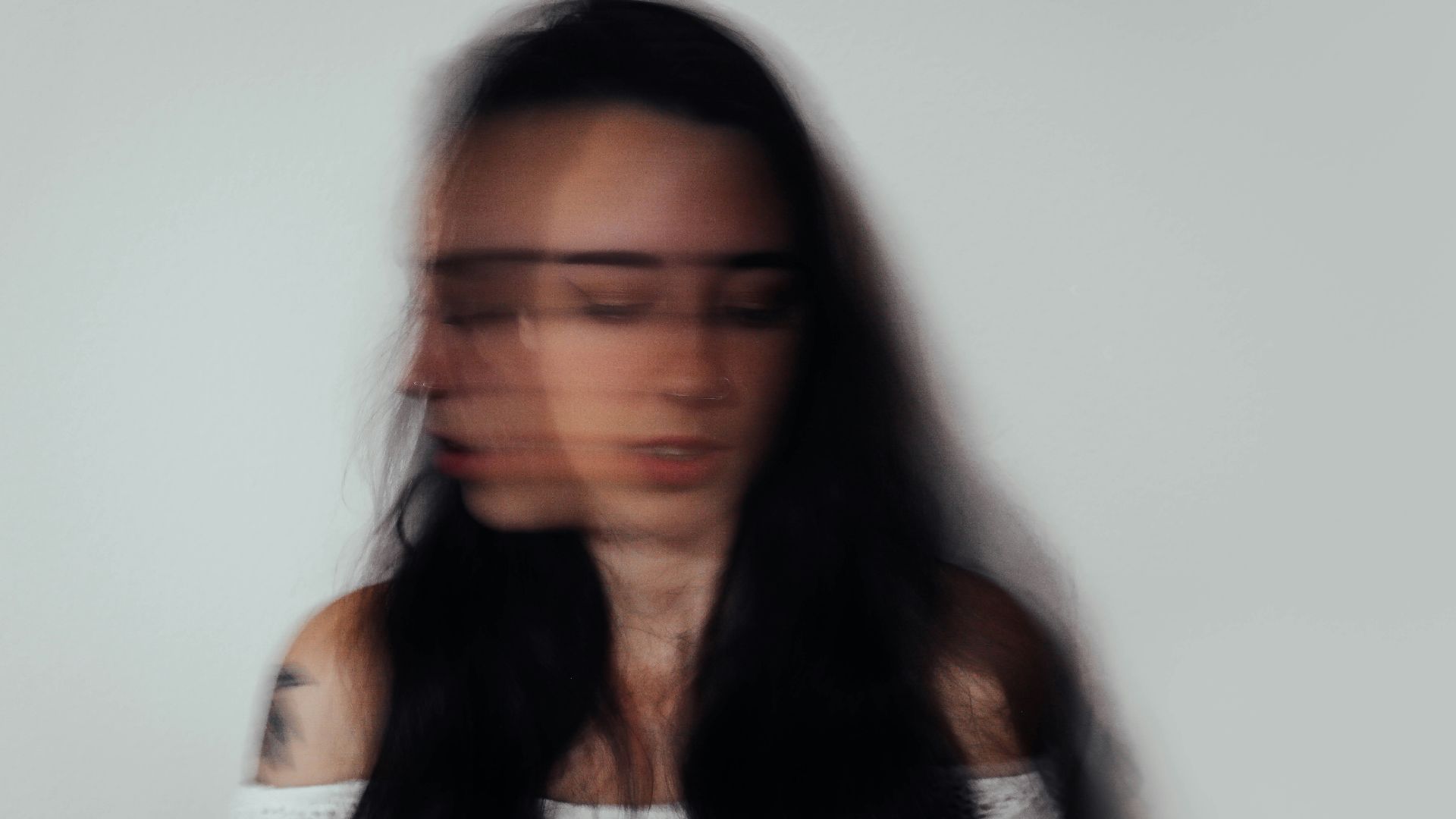 a blurry photo of a woman with glasses