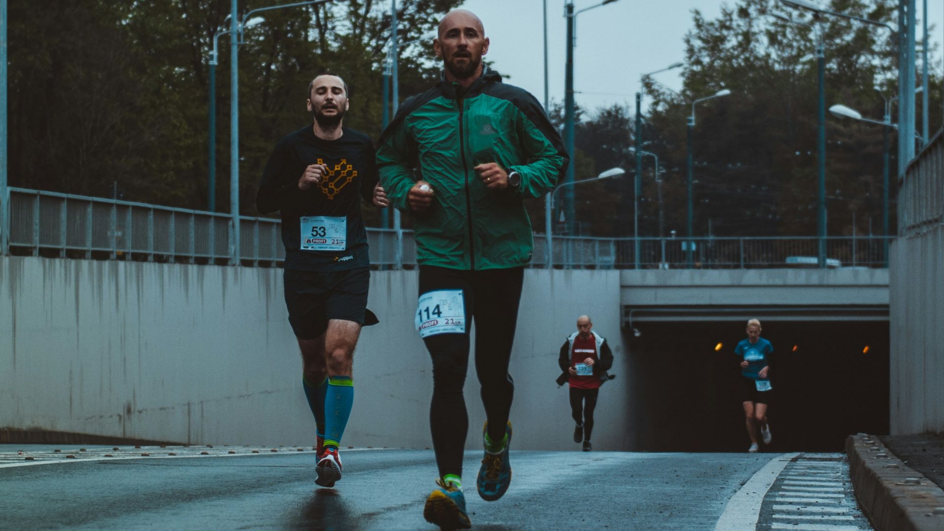 group of people running on street