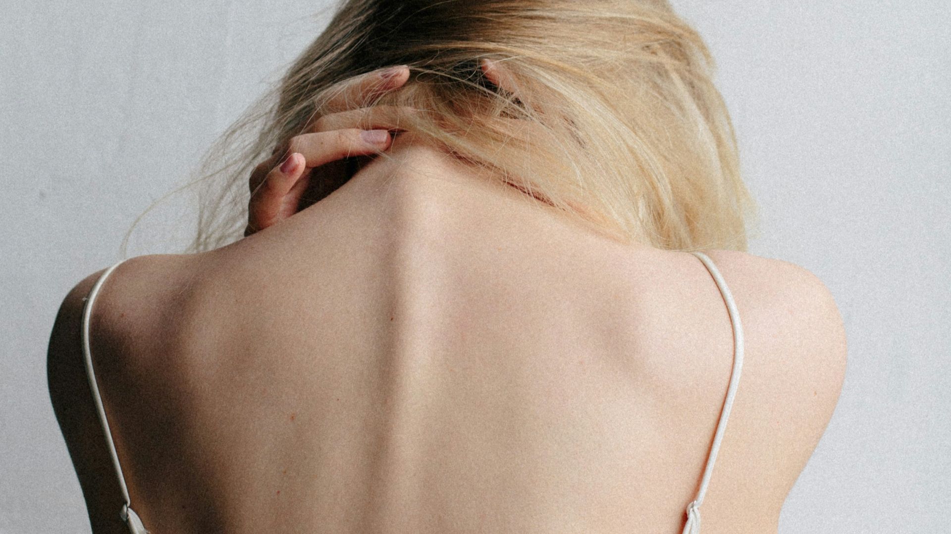 woman in white tank top