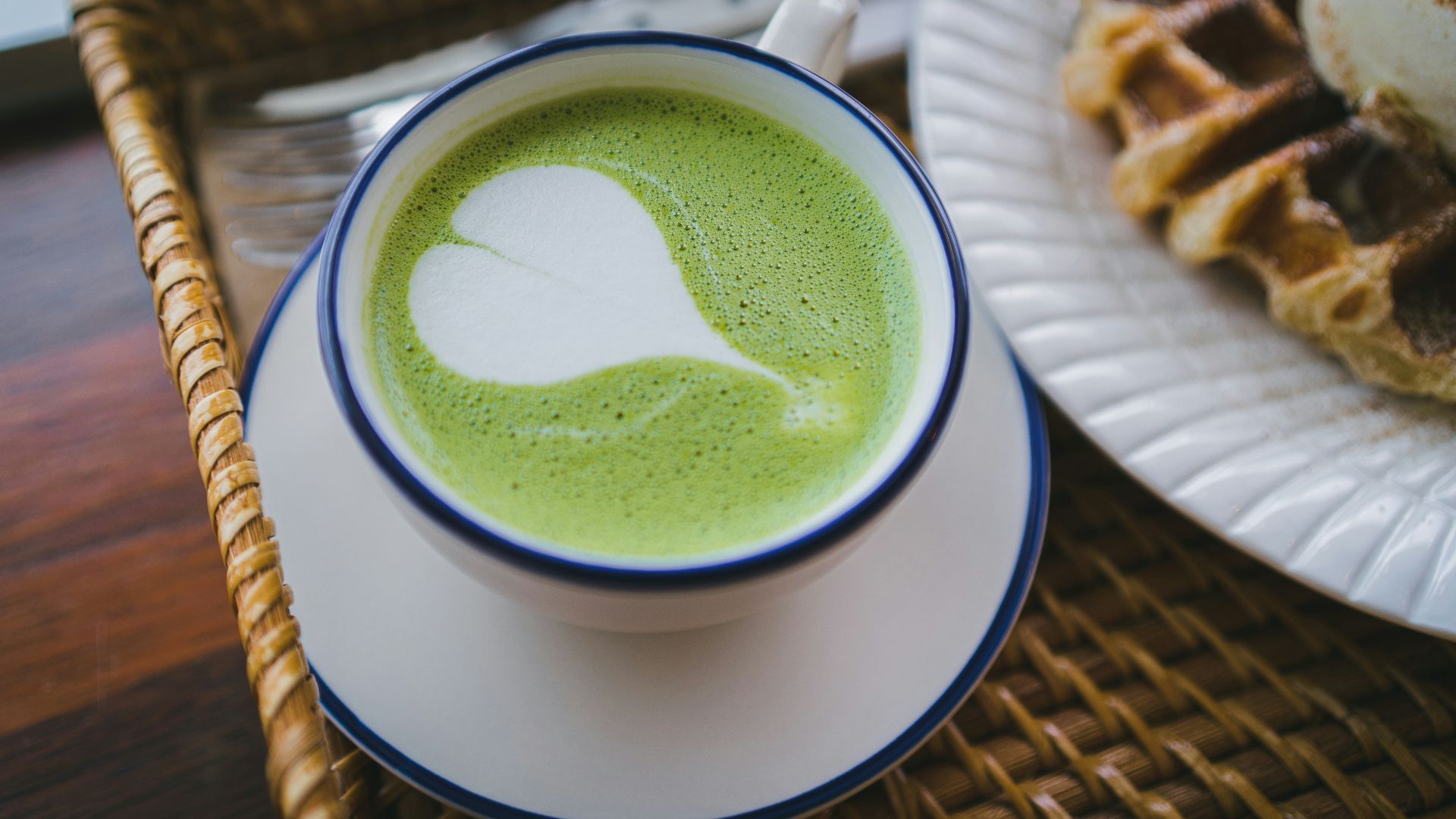 white ceramic mug with green liquid
